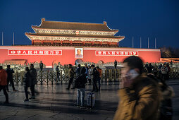 visitors and tourists in front of portrait of Mao Zedong at Tiananmen Gate which is the gate to the Forbidden City, Beijing, China, Asia