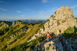 Woman while hiking rises to Aiplspitze, Aiplspitze, Mangfall Mountains, the Bavarian Alps, Upper Bavaria, Bavaria, Germany