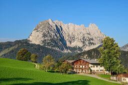 Farm with Wilder Kaiser in the background, from behind a mountain, Wilder Kaiser, Kaiser mountains, Tyrol, Austria