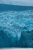 Sunlight lights up a section of the craggy glacier, Garibaldi Glacier, near Beagle Canal, Alberto de Agostini National Park, Magallanes y de la Antartica Chilena, Patagonia, Chile, South America