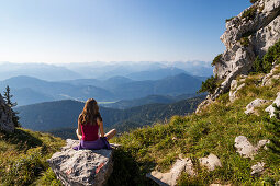 young woman enjoying panoramic view from Benediktenwand mountain, Upper Bavaria, Alps, Germany, Europe