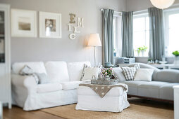 Modern Nordic Living room in family house with white and gray furniture and wooden floor, Korbach, Hesse, Germany, Europe