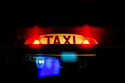 close-up of illuminated Taxi sign, Paris, France, Europe
