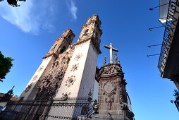 View from below of the towers of the Igleisia de Santa Prisca in the colonial old town of Taxco, Mexico