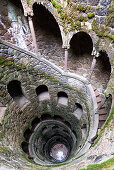 View into the initiation fountain in the garden Quinta da Regaleira, Sintra, Portugal