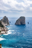 View of the Faraglioni rocks with regatta yachts, Capri Island, Gulf of Naples, Italy