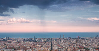 Barcelona skyline at sunset with rain cloud