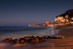 Cefalu city skyline with beach at night Sicily Italy