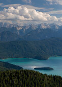 Turquoise Walchensee with Sassau island, forest, mountains and clouds, Bavaria