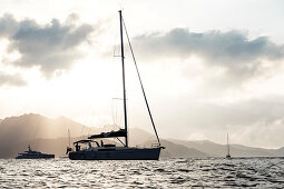 Boats and yachts in the evening light in front of Saint Florent, Corsica, France.