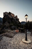 Citadel and street lamp at dusk, Corte, &quot;the secret capital of Corsica&quot;, Corsica, France.