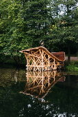 A wooden art installation on a village pond, Fiskars, Finland