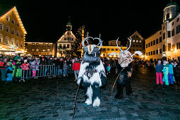 Two krampuses run through the old town, Klausenttrieb, Immenstadt im Allgäu, Oberallgäu, Bavaria, Germany, Europe