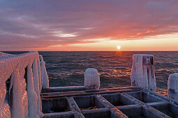 Icy jetty at Dahme pier, sunrise, ice, winter, Schleswig-Holstein, Germany
