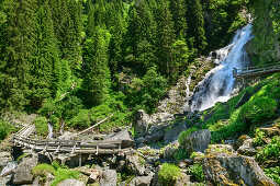 Wooden bridge and viewing platform in front of Sintersbach waterfall, Sintersbach waterfall, Kitzbühel Alps, Tyrol, Austria
