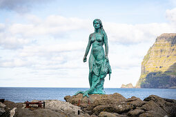 Bronze statue of the seal woman created by Hans Pauli Olsen, based on the folk tale in which the village of Mikladalur was cursed, Mikladalur, Kalsoy, Faroe Islands, Denmark.