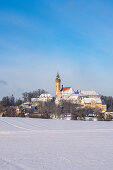 Andechs Monastery in a snowy winter landscape, Andechs, Bavaria, Germany.