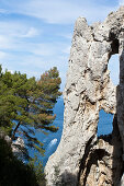Detail of Arco Naturale and view at sea in Capri, Italy