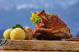 Bavarian pork knuckle enjoyed with a view, Winklmoos Alm, Reit im Winkl, Chiemgau, Bavaria, Germany