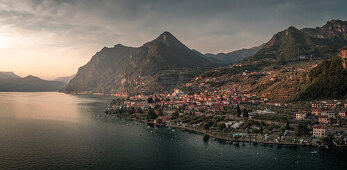 Panorama Lake Iseo with village Marone and mountains in sunset, from above, Italy