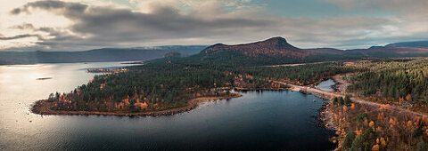 Panorama landscape with lake and mountains in Stora Sjöfallet National Park in autumn in Lapland in Sweden from above