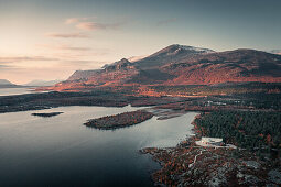 Landscape with mountains, lake and visitor center in Stora Sjöfallet National Park in autumn in Lapland in Sweden from above