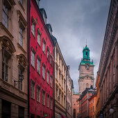 House facades with Tyska Kyrkan church in the old town Gamla Stan in Stockholm in Sweden