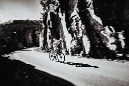 Road biking, woman riding a racing bike on the road