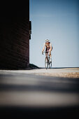 Road biking, woman riding a racing bike on the road