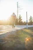 Road biking, woman riding a racing bike on the road