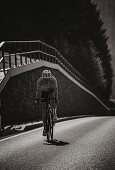 Road biking, woman riding a racing bike on the road