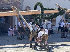 Maypole erection in the municipality of Jachenau, Bavaria, Germany