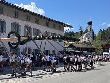 Maypole erection in the municipality of Jachenau, Bavaria, Germany