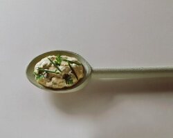 Sauce tartare on wooden spoon