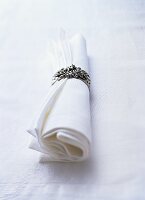 Fabric napkin with silver napkin ring