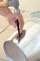 Making a barbecue bucket (making holes with a punch)