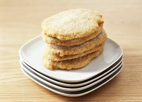 Frozen escalopes lying on a pile of plates to thaw