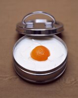 Quark dessert with peach in tin with lid
