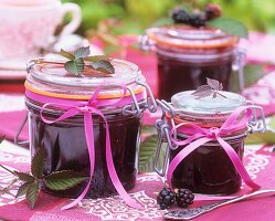 Home-made blackberry jam in preserving jars