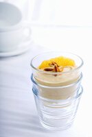 Peanut cream with mandarin orange and pine nuts