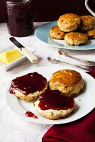 Scones with butter and strawberry jam