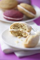 A whoopie pie with a bite taken out of it (close-up)