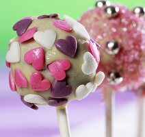Cake pops, chilled and decorated with sugar strands