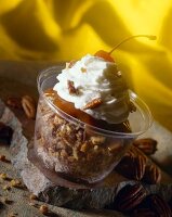 Walnut caramel sundae with whipped cream