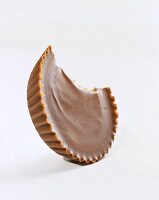 Peanut Butter Cup with Bite Taken Out; White Background