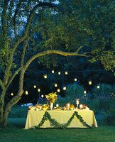 Summer buffet in candlelit garden 