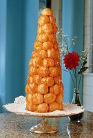 Croquembouche on a Pedestal Dish, Flowers in a Vase