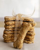 Stack of Homemade Dog Biscuits Tied with a Ribbon; One Loose Biscuit