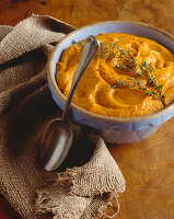 Bowl of Carrot Puree with Thyme Sprig
