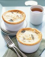 Individual Pot Pies with Herbs in Top Crust